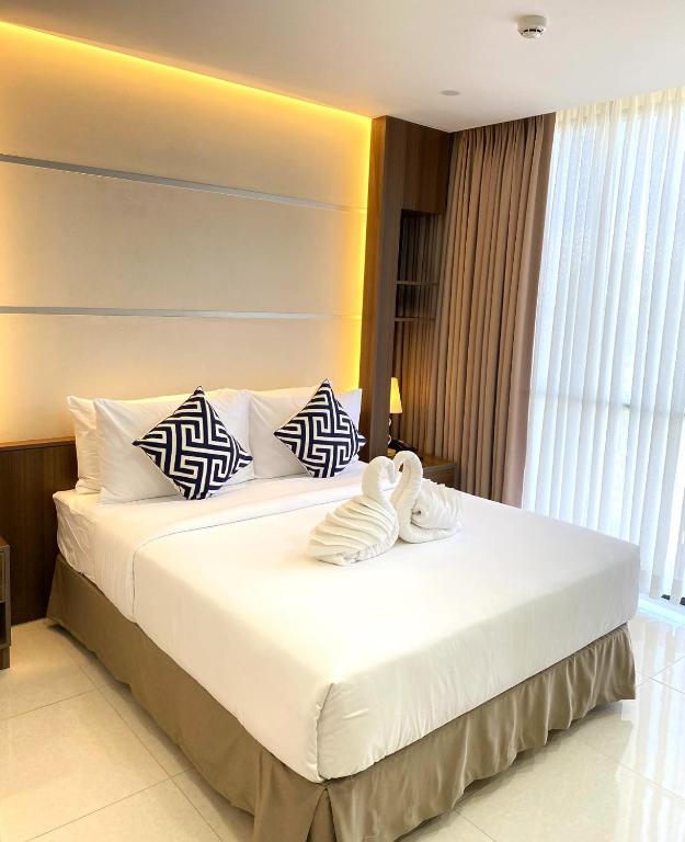 Postel nebo postele na pokoji v ubytování DCCCO Hotel