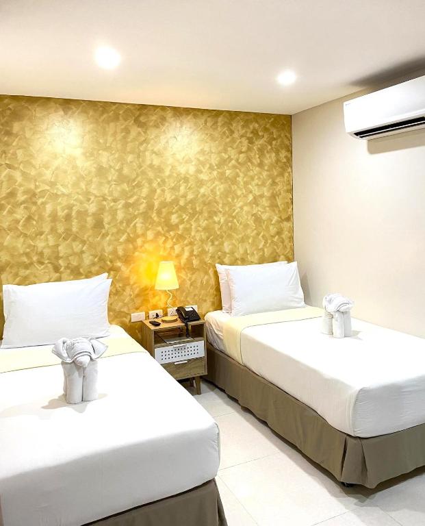 Postel nebo postele na pokoji v ubytování DCCCO Hotel