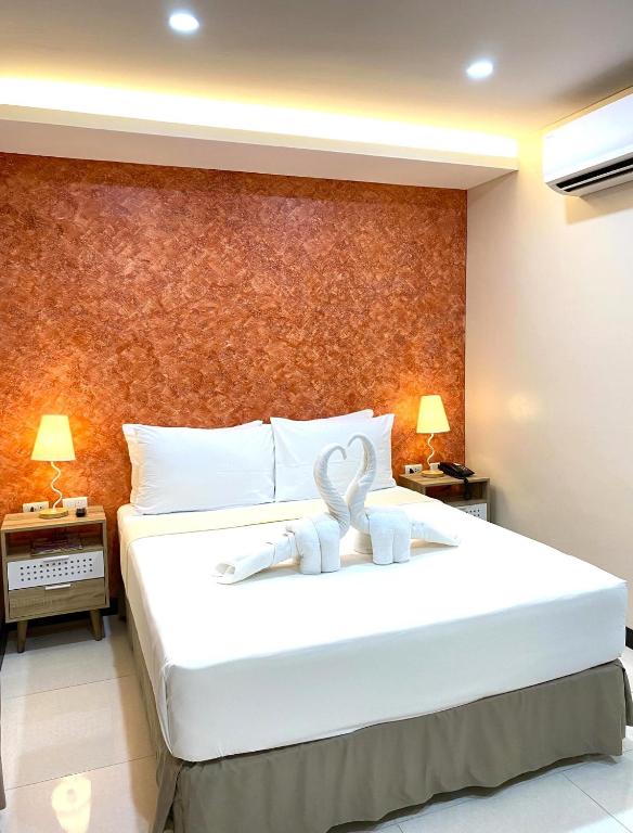 Postel nebo postele na pokoji v ubytování DCCCO Hotel