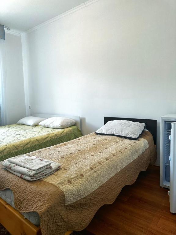 Postel nebo postele na pokoji v ubytování Guest House Arbat