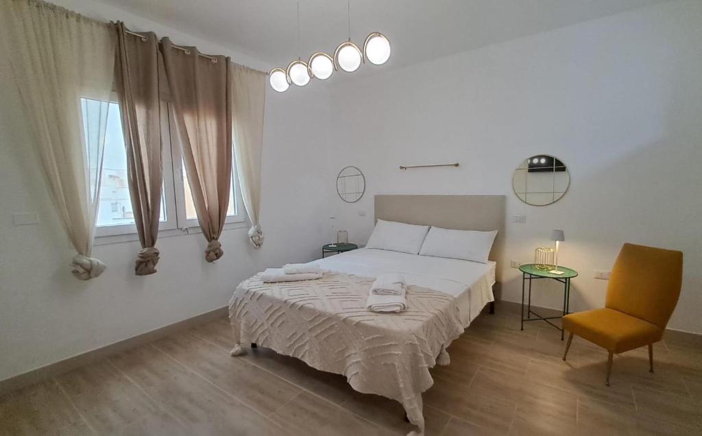 Postel nebo postele na pokoji v ubytování Isid'Oro Rooms