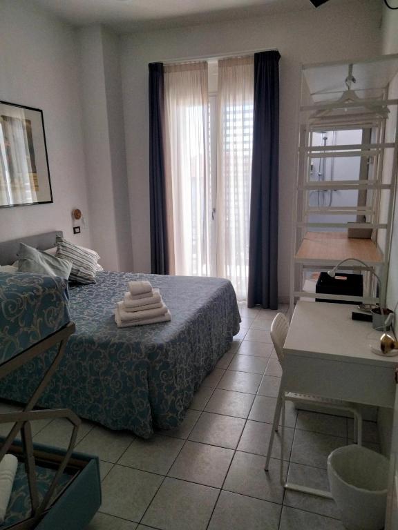 Postel nebo postele na pokoji v ubytování Albergo Aquila