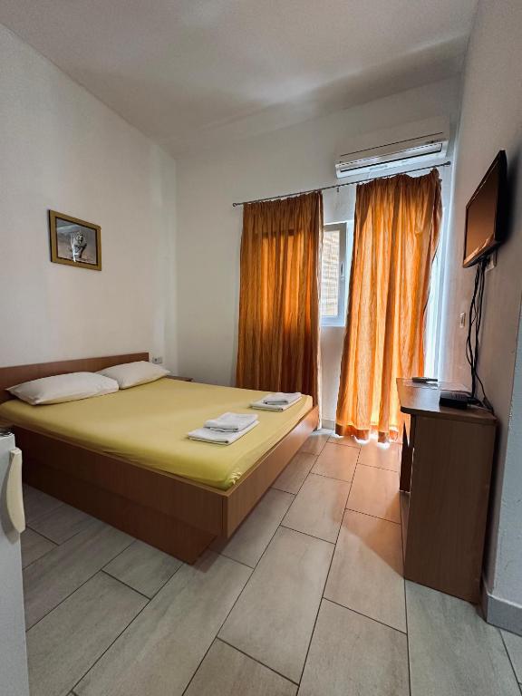 Postel nebo postele na pokoji v ubytování Apartments Mango