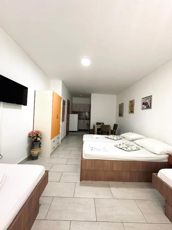 Postel nebo postele na pokoji v ubytování Apartments Mango