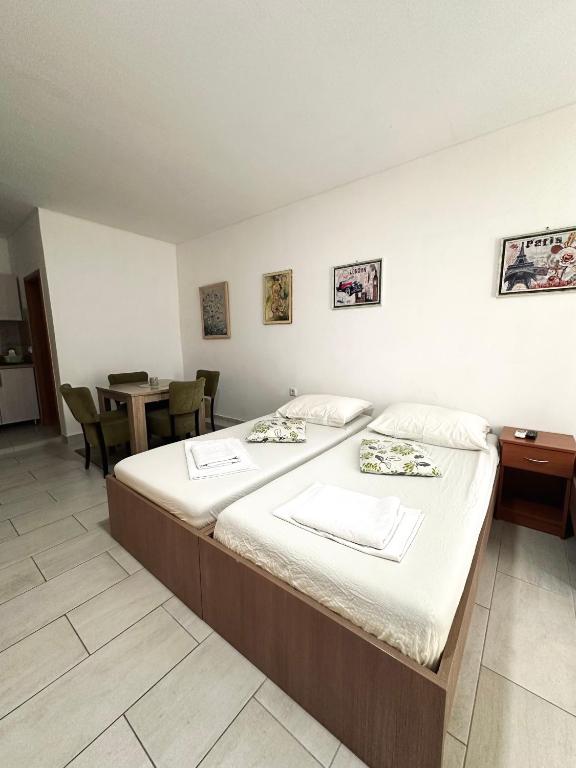 Postel nebo postele na pokoji v ubytování Apartments Mango