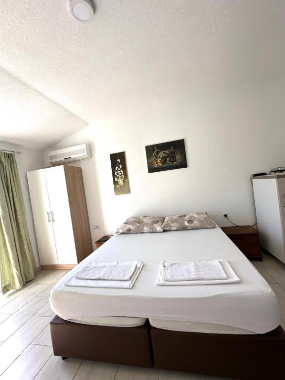 Postel nebo postele na pokoji v ubytování Apartments Mango