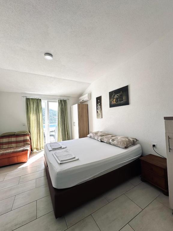 Postel nebo postele na pokoji v ubytování Apartments Mango