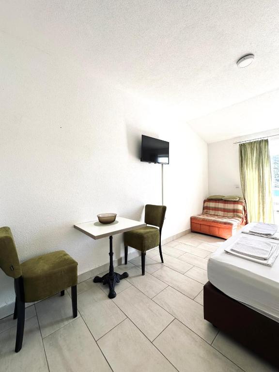Postel nebo postele na pokoji v ubytování Apartments Mango