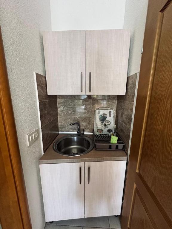 Kuchyň nebo kuchyňský kout v ubytování Apartments Mango