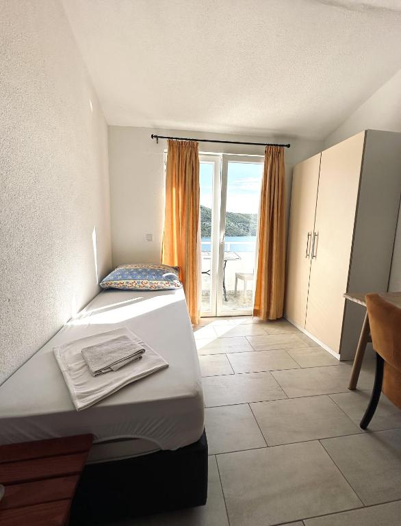 Postel nebo postele na pokoji v ubytování Apartments Mango
