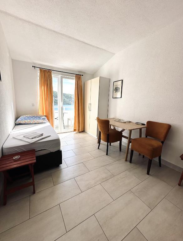 Postel nebo postele na pokoji v ubytování Apartments Mango