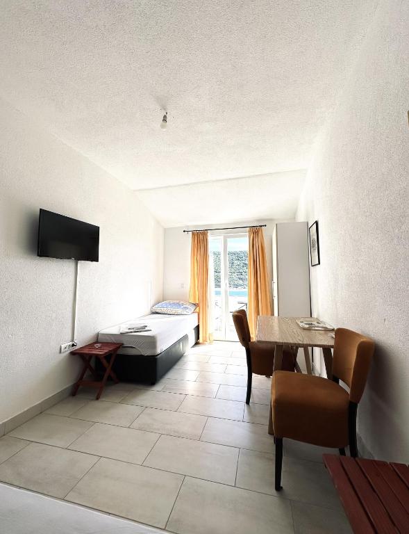 TV a/nebo společenská místnost v ubytování Apartments Mango