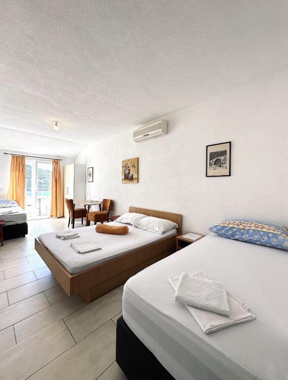 Postel nebo postele na pokoji v ubytování Apartments Mango