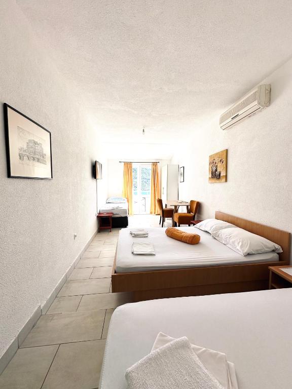 Postel nebo postele na pokoji v ubytování Apartments Mango