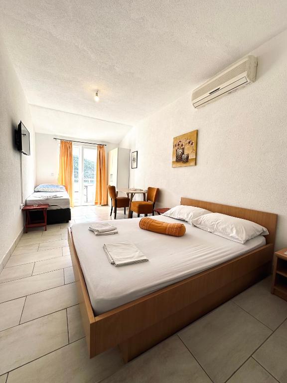 Postel nebo postele na pokoji v ubytování Apartments Mango