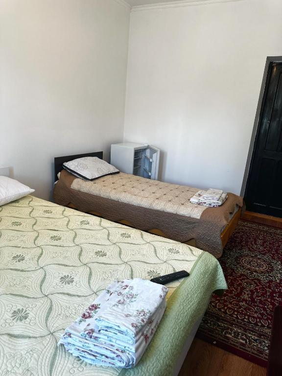 Postel nebo postele na pokoji v ubytování Guest House Arbat