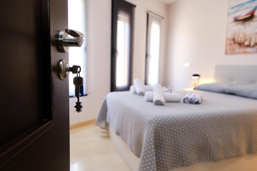 a door open to a bedroom with a bed at Habitaciones pensadas para ti in Fuengirola