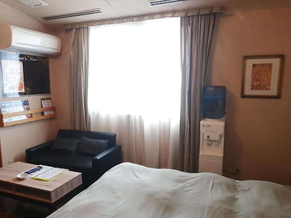 Postel nebo postele na pokoji v ubytování 月のあかり