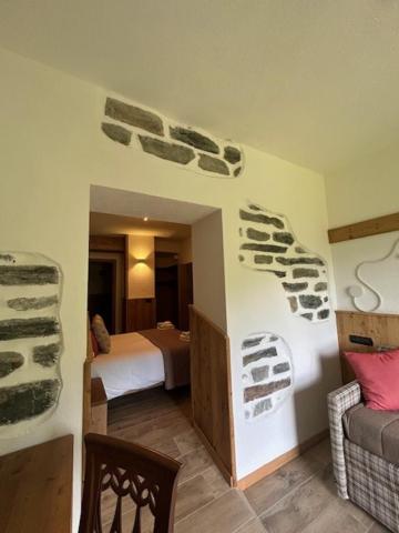 Postel nebo postele na pokoji v ubytování Edelweiss Hotel Champoluc