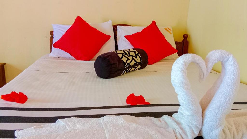 Postel nebo postele na pokoji v ubytování Sigiri Thilanka Rest Sigiriya