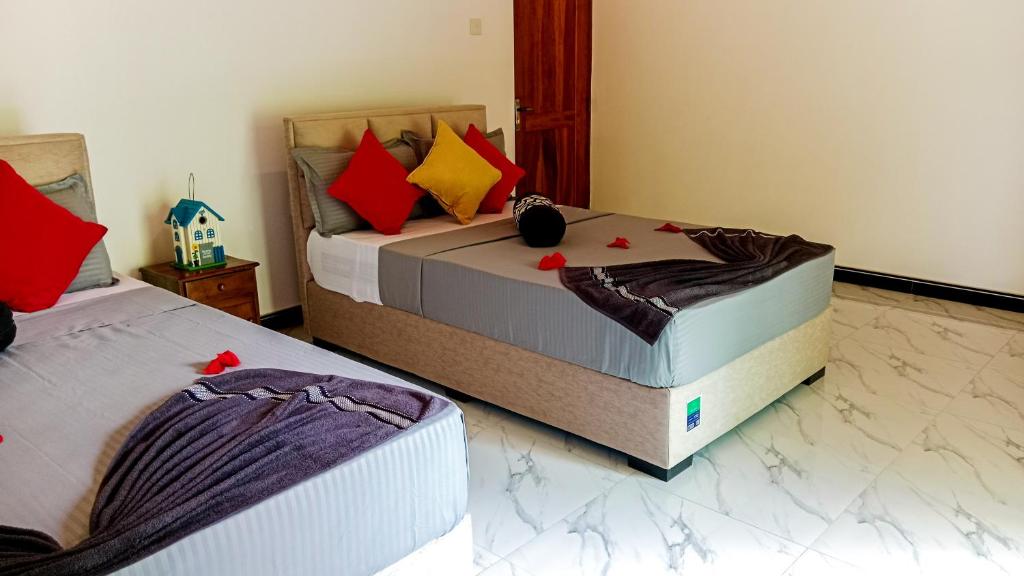 Postel nebo postele na pokoji v ubytování Sigiri Thilanka Rest Sigiriya