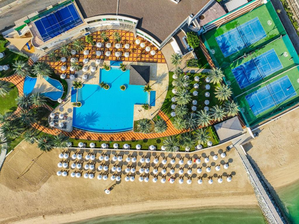 an overhead view of a resort with a pool at Beach Rotana - Abu Dhabi in Abu Dhabi