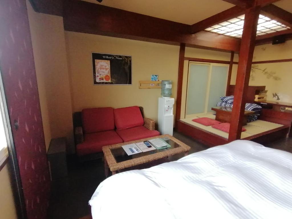 Postel nebo postele na pokoji v ubytování 月のあかり
