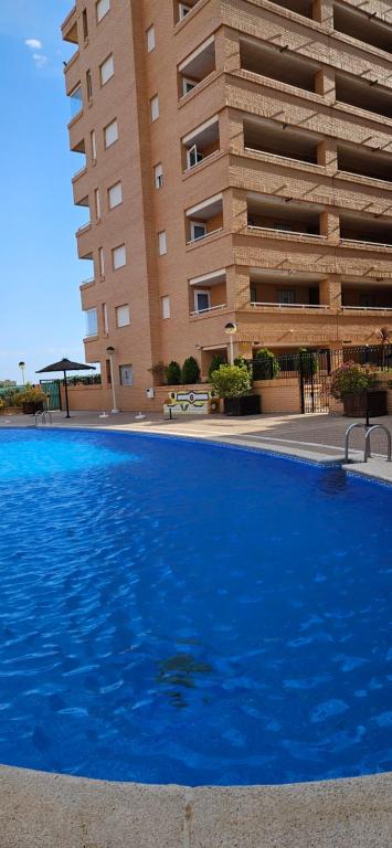 Bazén v ubytování Apartamento acogedor en Magic World, Torre la Sal nebo v jeho okolí
