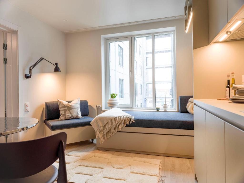 Postel nebo postele na pokoji v ubytování Unity Malmö - A Studio Hotel