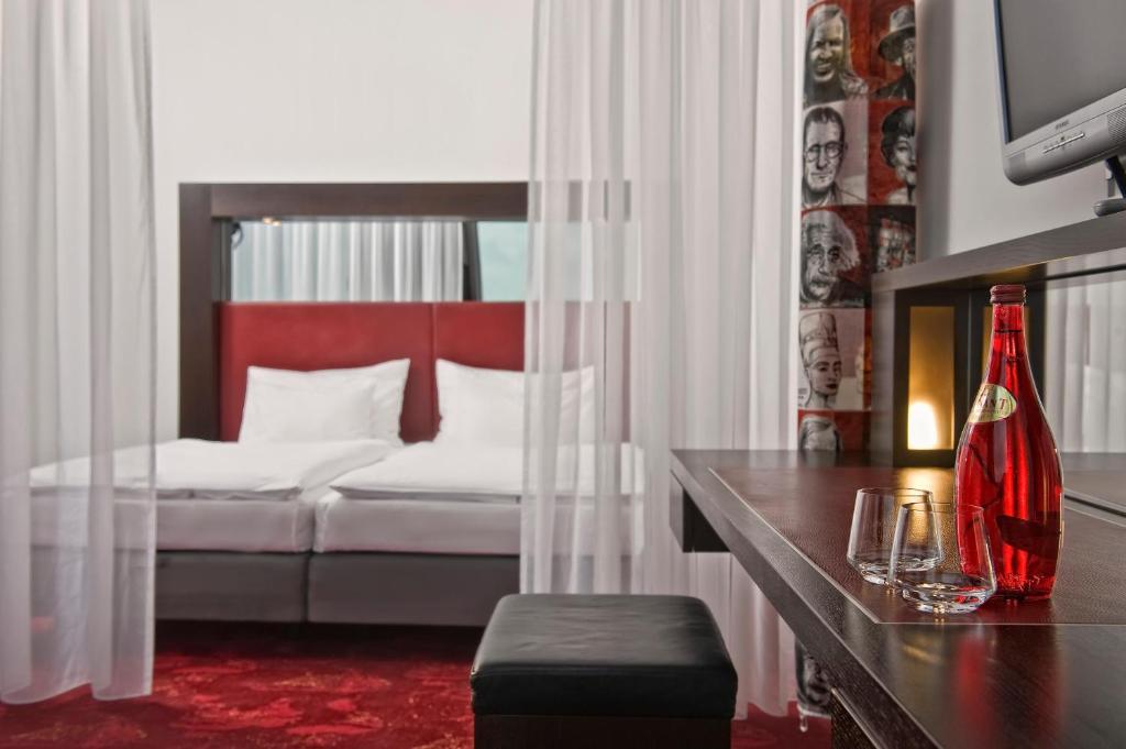 Postel nebo postele na pokoji v ubytování ARCOTEL Velvet Berlin