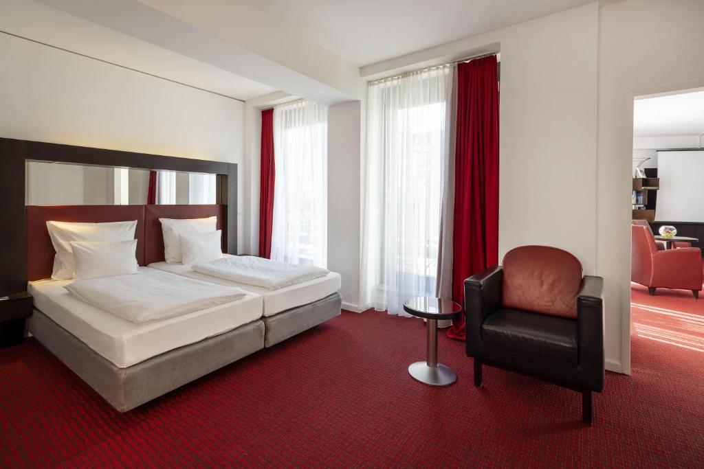 Postel nebo postele na pokoji v ubytování ARCOTEL Velvet Berlin