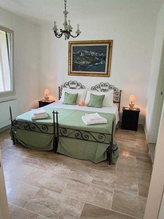 Postel nebo postele na pokoji v ubytování Villa Marianna