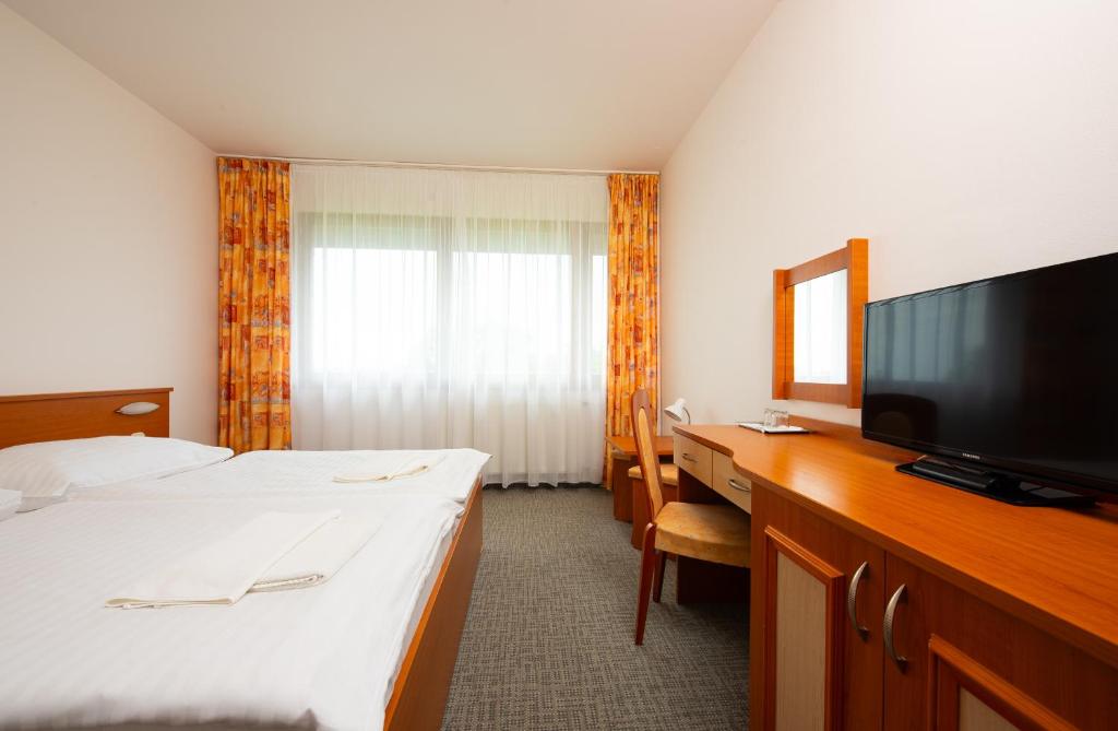 Postel nebo postele na pokoji v ubytování Hotel SOREA TITRIS