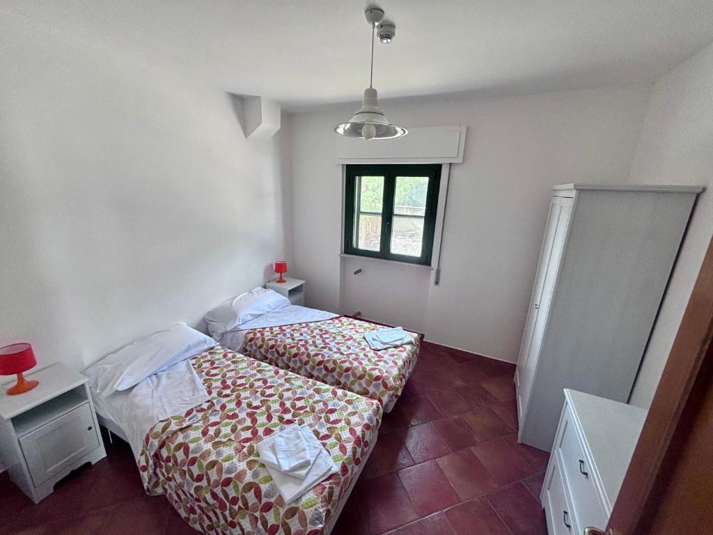 Postel nebo postele na pokoji v ubytování San Francesco Lodge