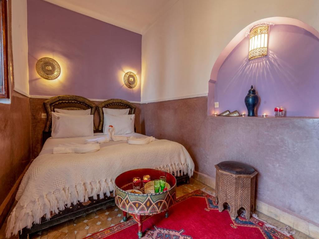 Postel nebo postele na pokoji v ubytování Riad Zehar & Spa Marrakech