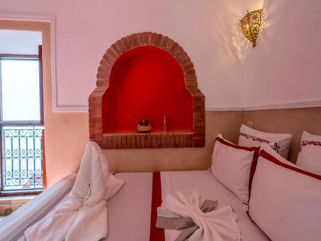 Postel nebo postele na pokoji v ubytování Riad Zehar & Spa Marrakech