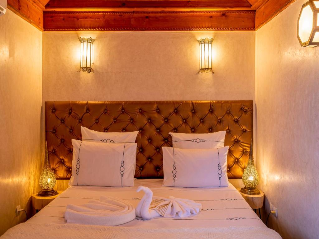 Postel nebo postele na pokoji v ubytování Riad Zehar & Spa Marrakech