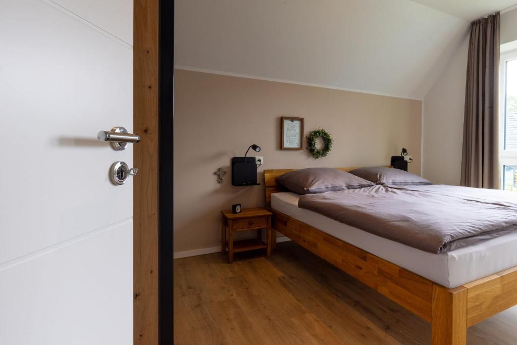 Postel nebo postele na pokoji v ubytování Ferienhaus Liegeplatz Dangast