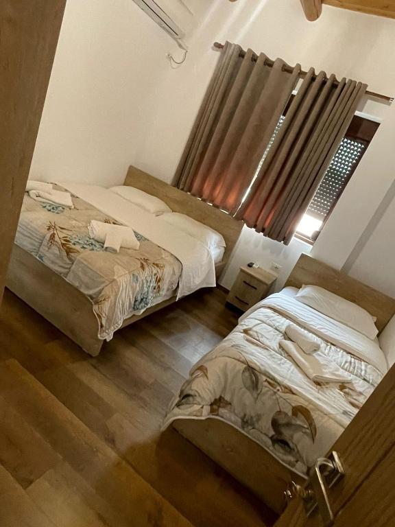 Postel nebo postele na pokoji v ubytování Guest House Bracaj