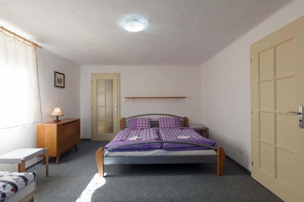 Postel nebo postele na pokoji v ubytování Cihlářka
