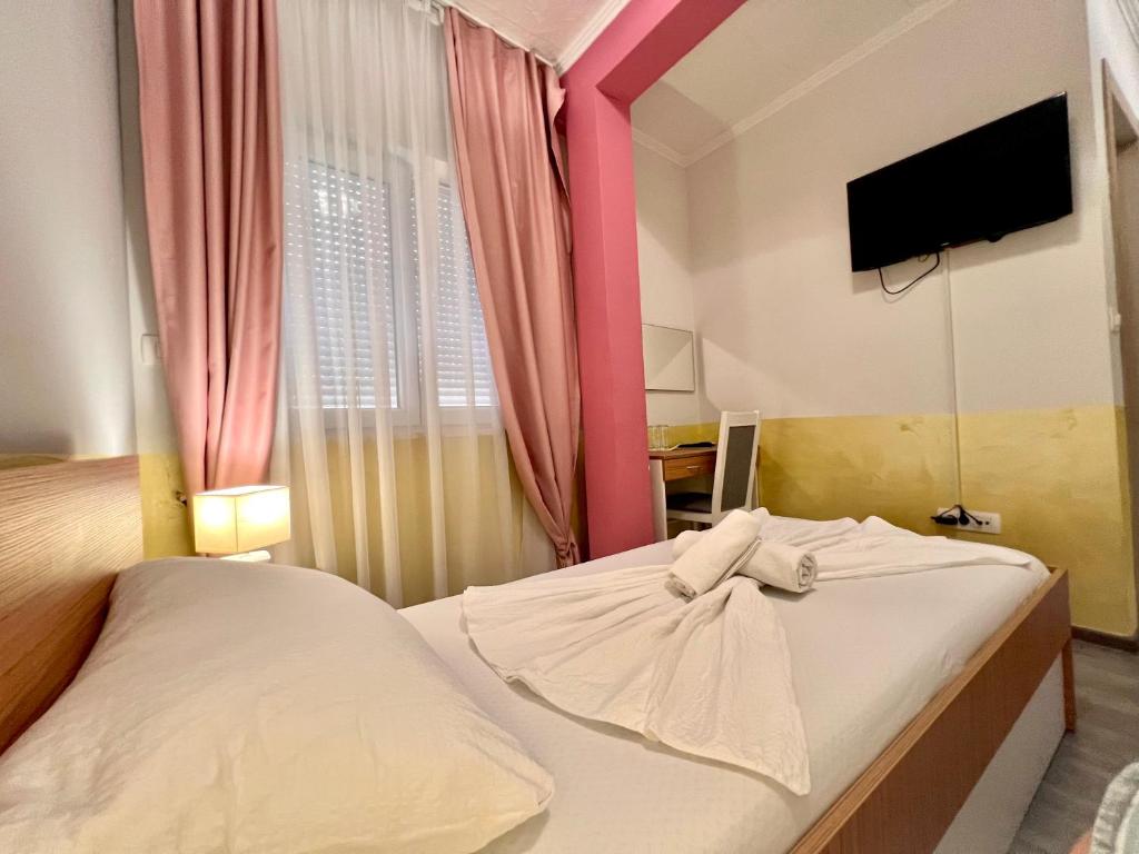 Postel nebo postele na pokoji v ubytování Hotel Nur