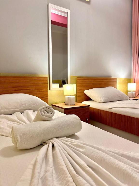 Postel nebo postele na pokoji v ubytování Hotel Nur