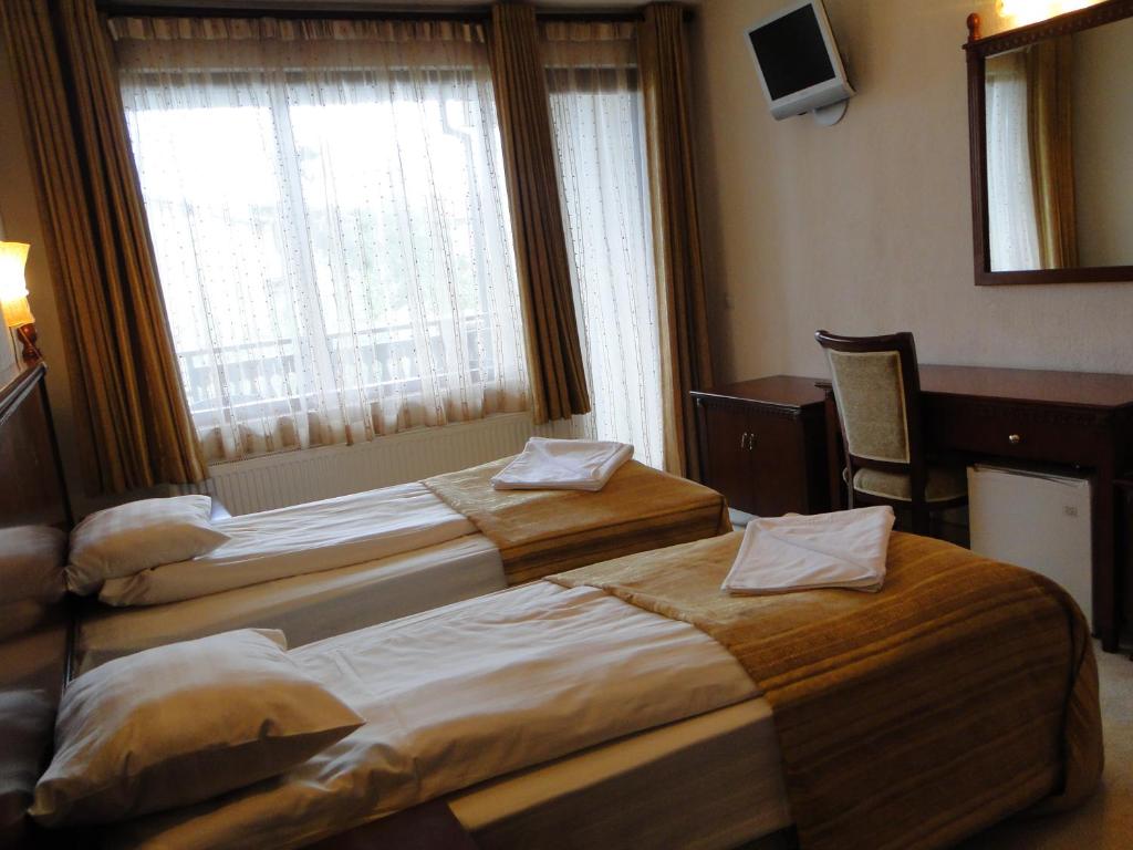 Postel nebo postele na pokoji v ubytování Guest House Chicho Tsane