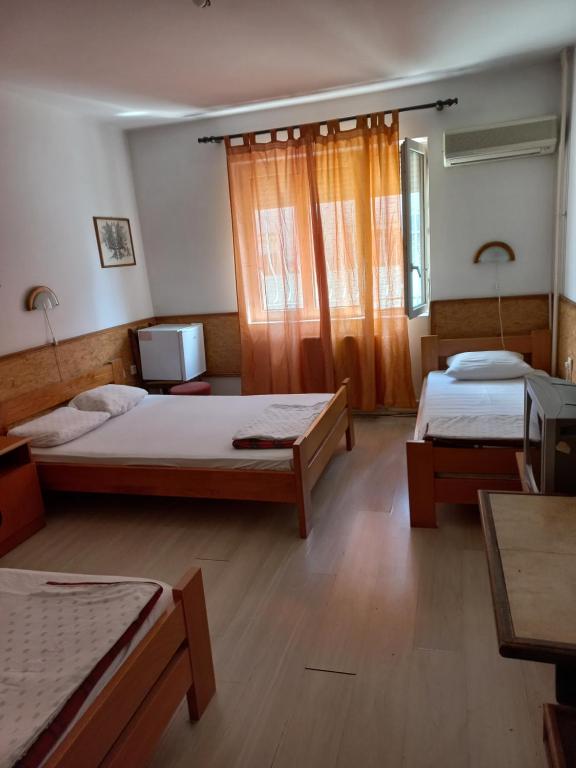 Postel nebo postele na pokoji v ubytování Hotel Duga