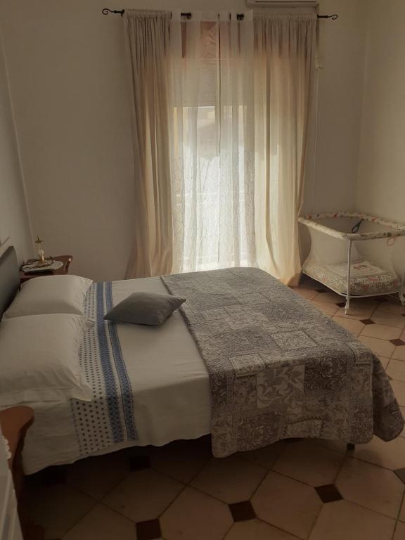 Postel nebo postele na pokoji v ubytování Casa dello Scoglio nel mare