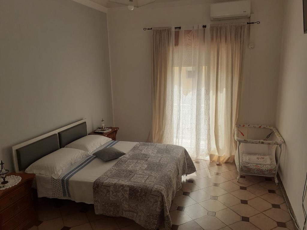 Postel nebo postele na pokoji v ubytování Casa dello Scoglio nel mare