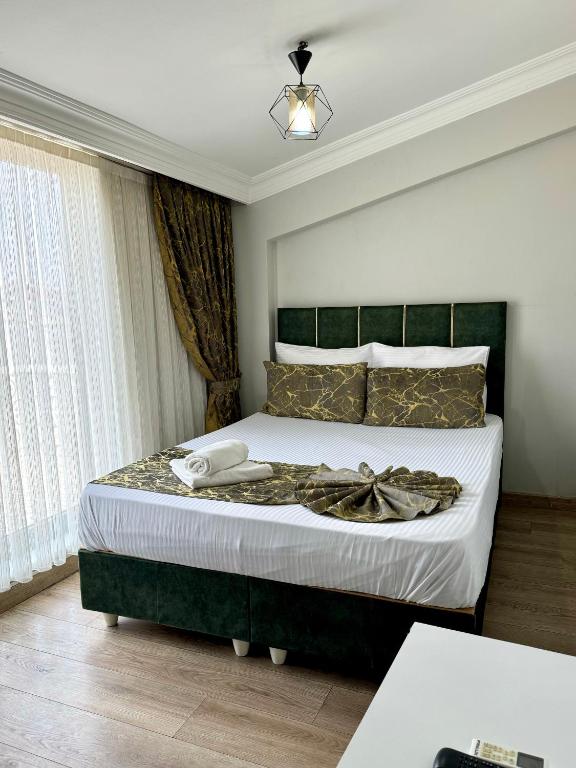 Postel nebo postele na pokoji v ubytování The Pashaam Suit Bakırköy