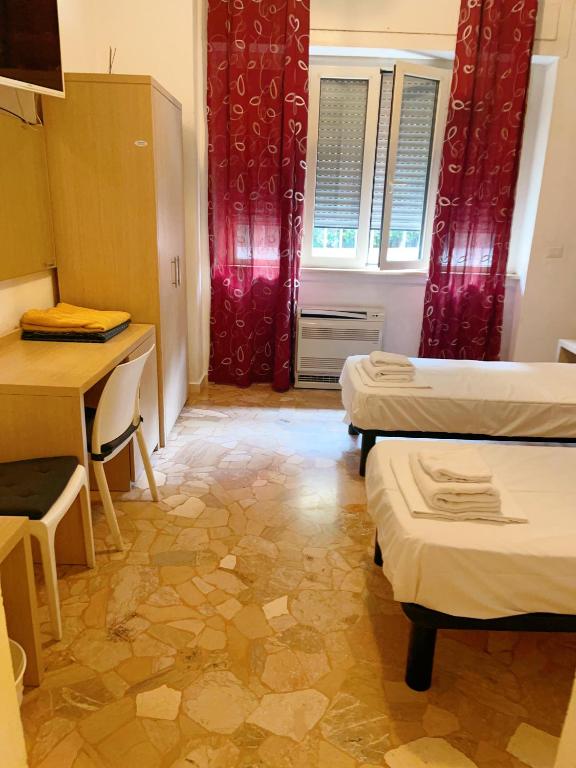 Postel nebo postele na pokoji v ubytování HOTEL BISSI