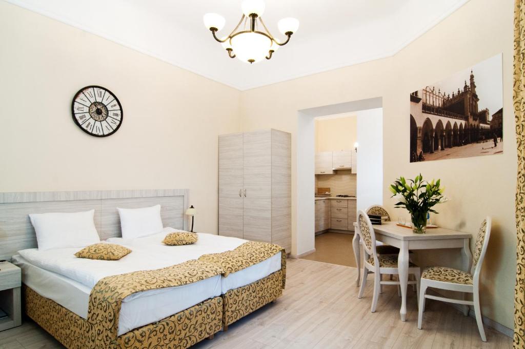 Postel nebo postele na pokoji v ubytování Apartamenty Bonerowska 5
