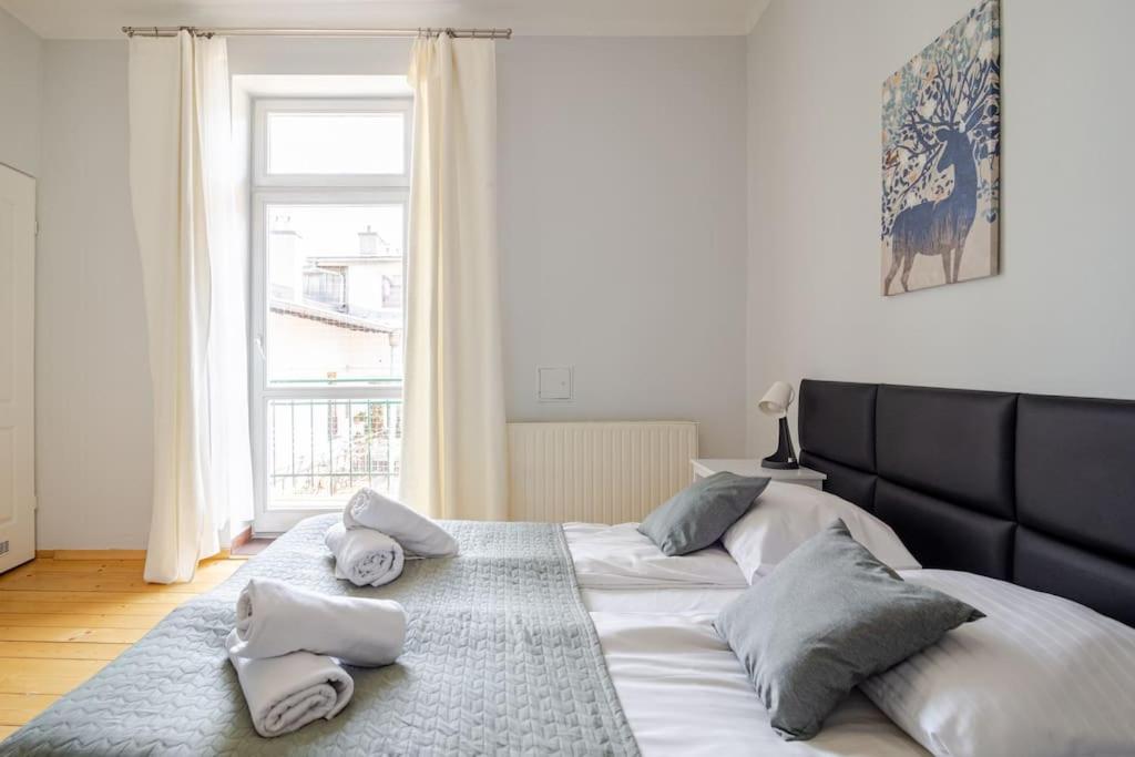 Posteľ alebo postele v izbe v ubytovaní Florianska Gate Luxury Apartments